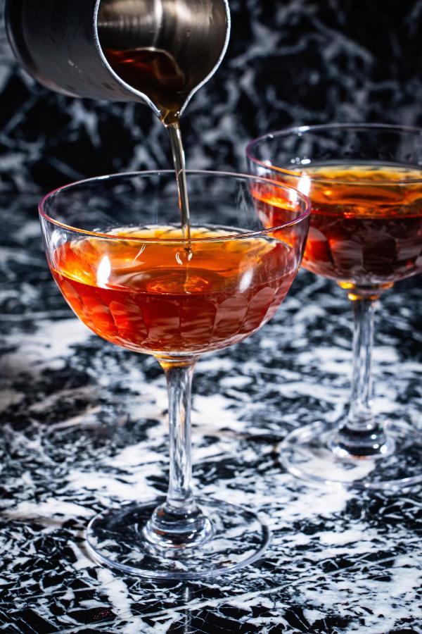 Riggs Washington Dc Hotel Kültér fotó A cognac being poured into a glass