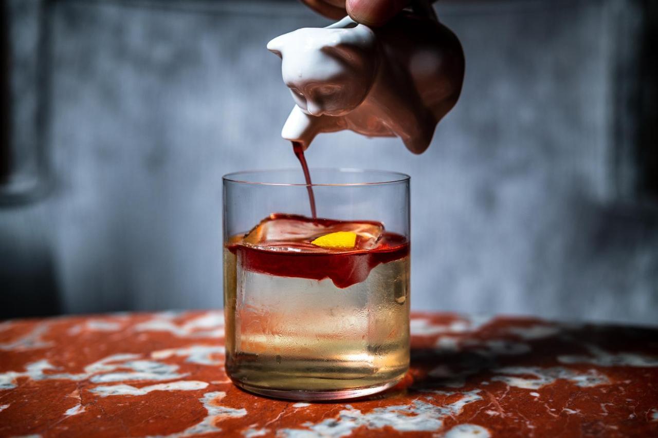 Riggs Washington Dc Hotel Kültér fotó A classic Old Fashioned cocktail being garnished with a cherry